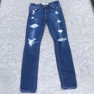 Dark ripped blue jeans